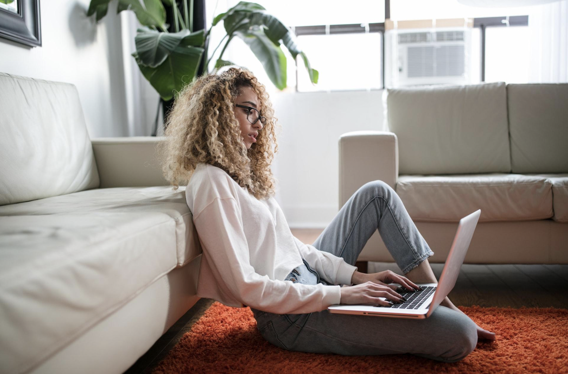 A picture of a businesswoman like Agata Everest working on non-profit work on her laptop.